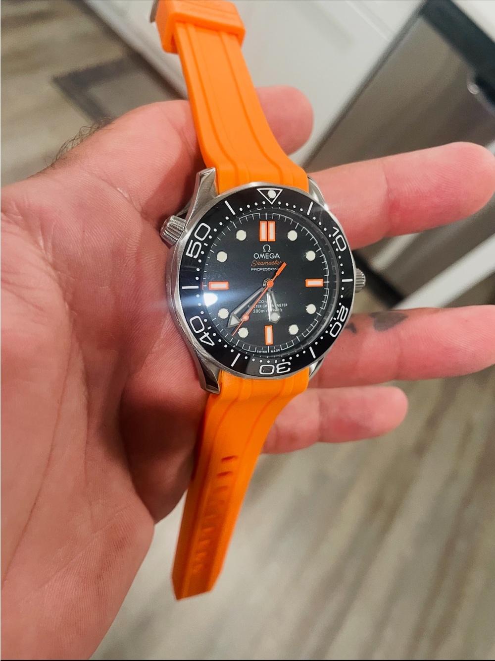 Omega Men's Swim Watch with Orange Strap and Black Dial
